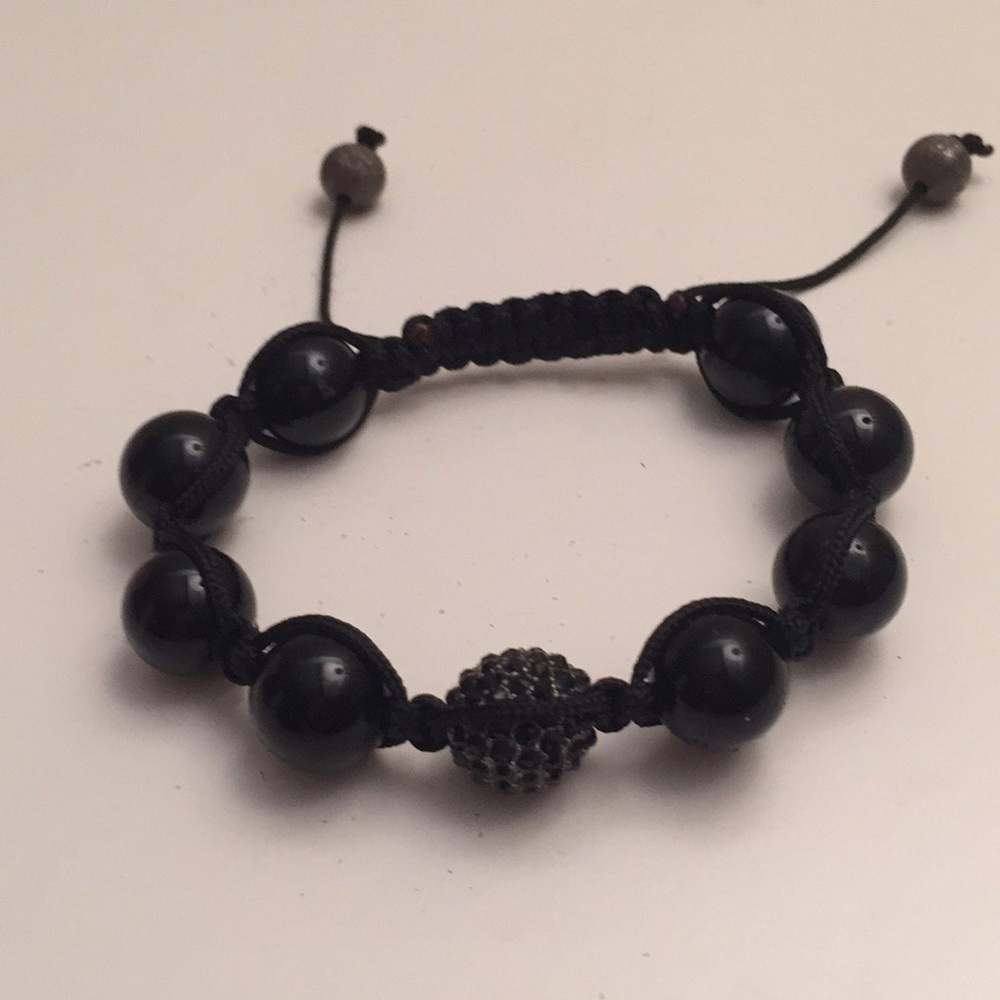 Black bead bracelet with crystal center